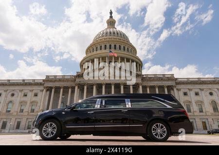 Washington, United States. 29th Apr, 2024. A hearse carries the remains of retired Army Col. Ralph Puckett to the Capitol on April 29, 2024 in Washington, DC. Col. Puckett was awarded the Medal of Honor in 2021 for his heroism in the Korean War. (Photo by Aaron Schwartz/Sipa USA) Credit: Sipa USA/Alamy Live News Stock Photo