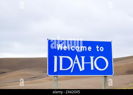 Viola, ID, USA - April 28. 2024; Blue and white road sign with Welcome to Idaho text Stock Photo