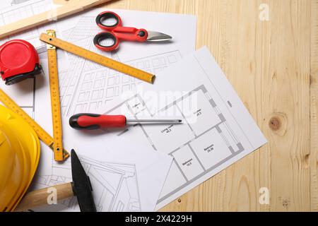 Flat lay composition with different construction tools on wooden background Stock Photo