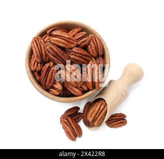 Tasty pecan nuts in bowl and scoop isolated on white, top view Stock Photo