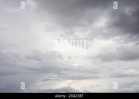 sky wallpaper with dark clouds in the day and environment outside, textured scene, storm and weather Stock Photo