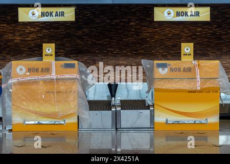 NAN, THAILAND, MAY 19 2023, A closed Nok Air check-in desk at an airport in northern Thailand Stock Photo