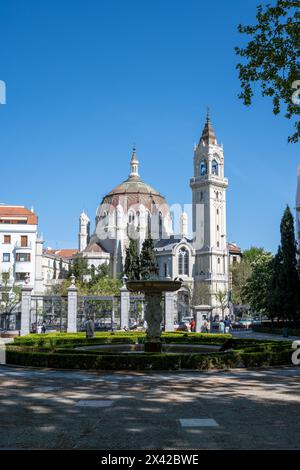 Madrid, Spain - April 13, 2024 - Church of Saint Manuel and Saint Benito as seen from El Retiro Park on clear sunny spring morning. Stock Photo