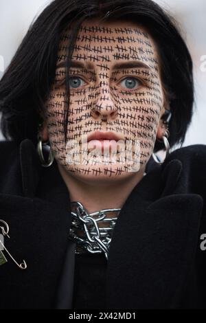Portrait of Ukrainian woman with face painting dedicated to captured Ukrainian soldiers who remain in russian prisons. Kyiv - 21 April,2024 Stock Photo