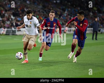 Fermin Lopez of FC Barcelona and Joao Rego of SL Benfica during the ...