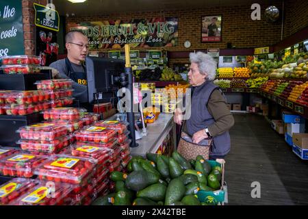 Shoppers at the South Melbourne market. The market is an inner city landmark and favorite of tourists. South Melbourne, Victoria, Australia. Stock Photo