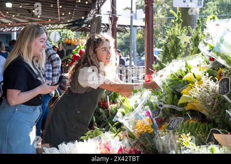 Shoppers at the South Melbourne market. The market is an inner city landmark and favorite of tourists. South Melbourne, Victoria, Australia. Stock Photo