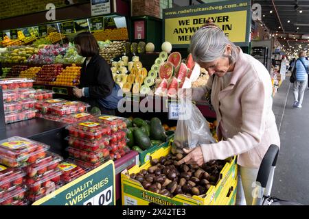 Shoppers at the South Melbourne market. The market is an inner city landmark and favorite of tourists. South Melbourne, Victoria, Australia. Stock Photo