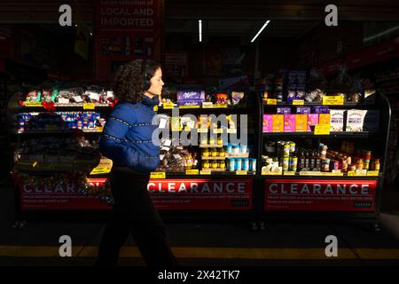 A woman shopping at the South Melbourne market. The market is an inner city landmark and favorite of tourists. South Melbourne, Victoria, Australia. Stock Photo