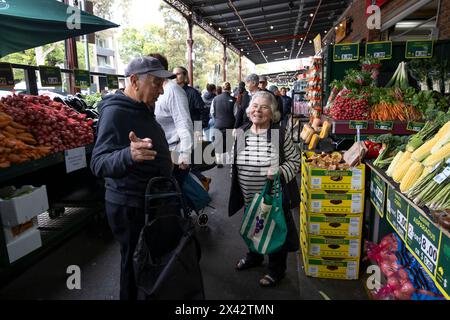 Shoppers at the South Melbourne market. The market is an inner city landmark and favorite of tourists. South Melbourne, Victoria, Australia. Stock Photo