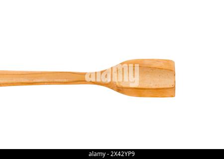 Kitchen spatula made of natural wood. Use for cooking on non-stick pans. Isolated on a white background. Close-up. Stock Photo