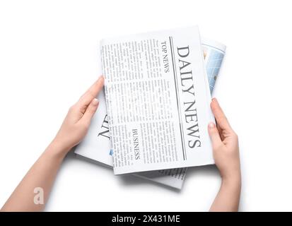 Female hands with different newspapers on white background Stock Photo