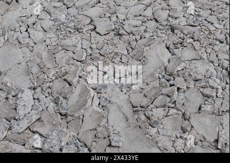 Texture of concrete road cracks on construction site background Stock Photo