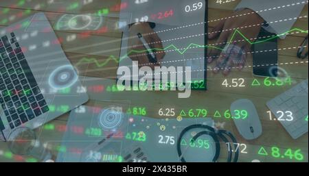 Image of financial data processing over biracial male doctor in hospital Stock Photo