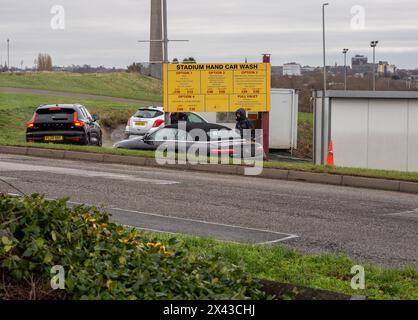 Cars being washed at a hand car wash business, Sixfields, Northampton, UK Stock Photo