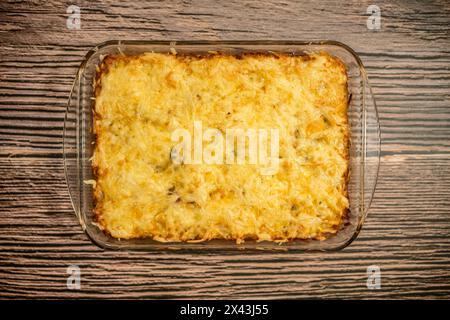 Top view of pie with meat and potato baked in oven in glass baking tray Stock Photo