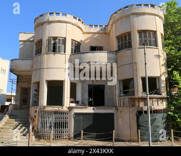 VAROSHA, FAMAGUSTA, NORTHERN CYPRUS-AUGUST 30,2023:Abandoned Old Cypriot House  with Damaged Windows and Doors and Blue Sky Background Stock Photo