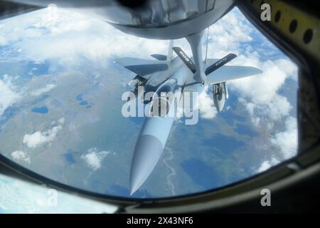 A U.S. Air Force F-15C Eagle assigned to the 44th Fighter Squadron from Kadena Air Base, Japan, refuels from a U.S. Air Force KC-135 Stratotanker, als Stock Photo