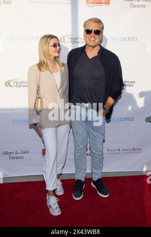 El Segundo, USA. 28th April, 2024. Emma Krokdal and Dolph Lundgren attend the red carpet arrivals of George Lopez 17th Annual Celebrity Golf Classic Topgolf Pre-Party Event, at Topgolf on April 28, 2024 Credit: Vladimir Yazev/Alamy Live News. Stock Photo