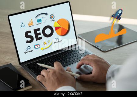 Businessman hands search on laptop engine optimization to SEO Search Engine Optimization Stock Photo