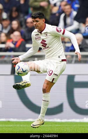 Milan, Italia. 14th Mar, 2024. FC Torino's Raoul Bellanova in action during the Serie A soccer match between Inter and Torino at the San Siro Stadium, north Italy - Sunday 28, April, 2024. Sport - Soccer . (Photo by Spada/LaPresse) Credit: LaPresse/Alamy Live News Stock Photo