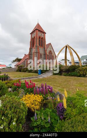 Christ Church Cathedral and the Whalebone Arch in Stanley, the capital of the Falkland Islands. Stanley, Falkland Islands. Stock Photo
