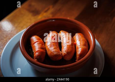 ready to eat fried chorizo plate tapa with bread Stock Photo - Alamy