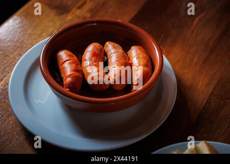 ready to eat fried chorizo plate tapa with bread Stock Photo - Alamy