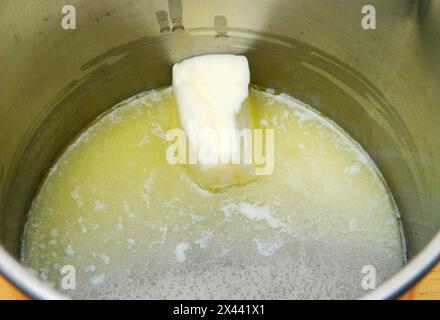 Close up on butter melting in a frying pan. Stock Photo