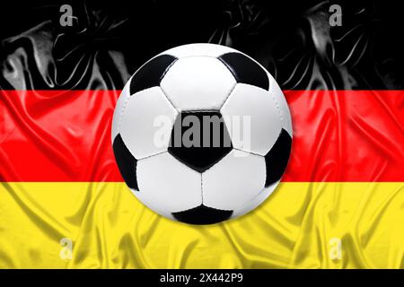 Black and white leather football with flag of Germany Stock Photo