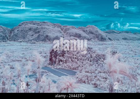 An infrared landscape picture taken looking across the Vinales valley at the dramatic Karst landscape. Near Vinales, Cuba Stock Photo