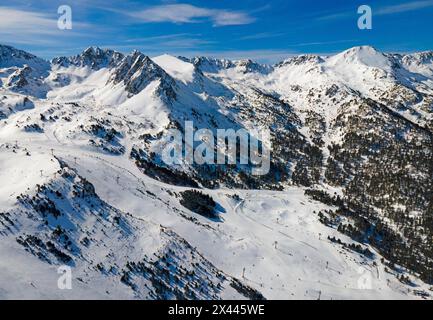 View of several mountain peaks and snowy landscapes with some trees visible, Grau Roig, Encamp, Andorra, Pyrenees Stock Photo