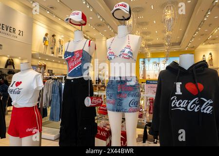 Branded Coca-Cola fashions highlighted at Forever 21 in Times Square, 2024, New York City, USA Stock Photo