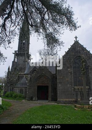 Le Faou, France - Apr 6, 2024: Eglise Notre Dame De Rumengol. Cloudy spring day. Selective focus Stock Photo