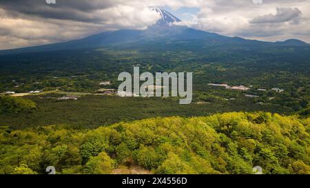 Aerial view of a cloud covered Mount Fuji and forest near Saiko, Japan Stock Photo