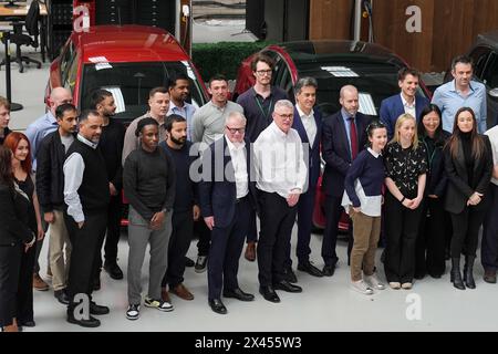 West Midlands Mayoral candidate for Labour Richard Parker has a photograph taken with staff members, alongside Shadow Cabinet members Ed Miliband and Jonathan Reynolds during a visit to Petalite, an electric vehicle charging company in Birmingham, ahead of the election for the mayor of the West Midlands on May 2. Picture date: Tuesday April 30, 2024. Stock Photo