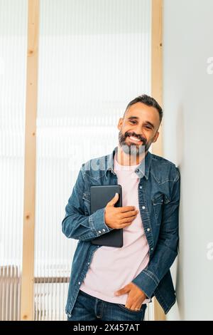 Portrait of a smiling middle-aged white man in a coworking Stock Photo