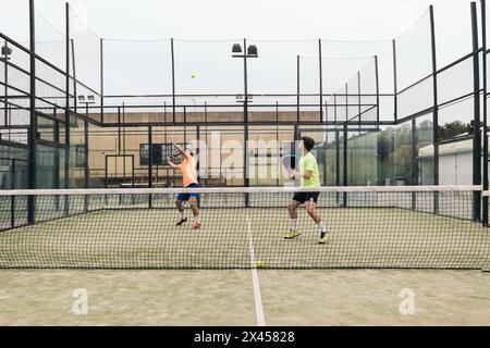 two young man playing paddle tennis Stock Photo