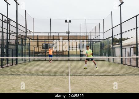 two young man playing paddle tennis Stock Photo