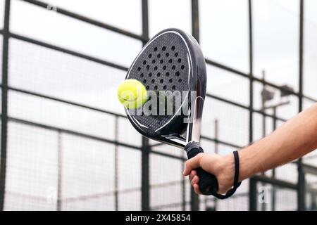 paddle tennis racket hitting ball. close- up on the racket Stock Photo