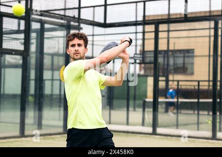 man playing paddle tennis. backhand Stock Photo