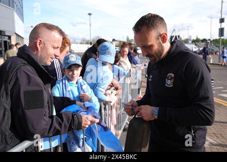 Coventry City's Liam Kelly signs autographs for fans ahead of the Sky Bet Championship match at the Coventry Building Society Arena, Coventry. Picture date: Tuesday April 30, 2024. Stock Photo