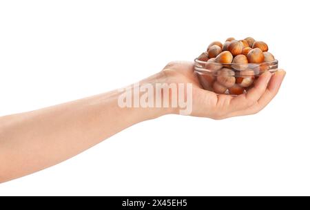 hazelnuts bowl in hand path isolated on white Stock Photo