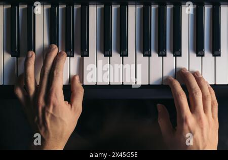 man playing piano. top view. Stock Photo