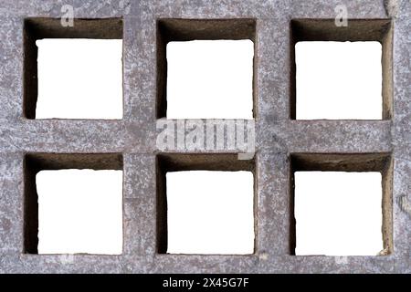 Cement grate with six square-shaped holes on a white background. Stock Photo
