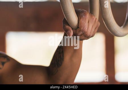 man hand holding a gymnastic ring. close-up Stock Photo