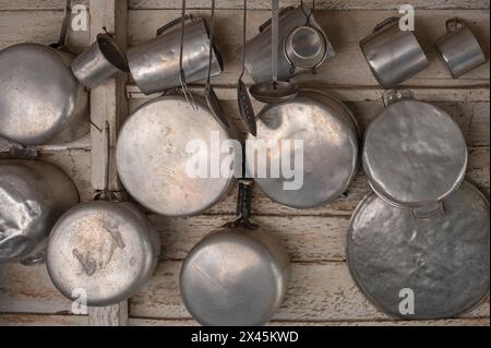 Well used kitchen utensils hanging on the walls in the farmhouse at a coffee farm near Vinales, Cuba Stock Photo