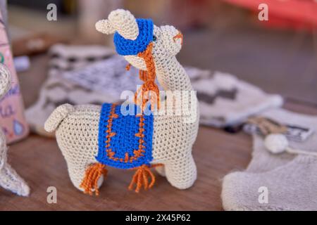 handmade crochet knitted doll of a small white llama. decoration, horizontal Stock Photo