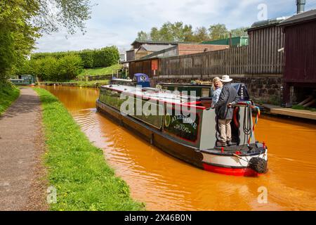Canal narrowboats passing through Kidsgrove in Staffordshire England on the Trent and Mersey canal Stock Photo