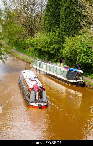Canal narrowboats passing through Kidsgrove in Staffordshire England on the Trent and Mersey canal Stock Photo